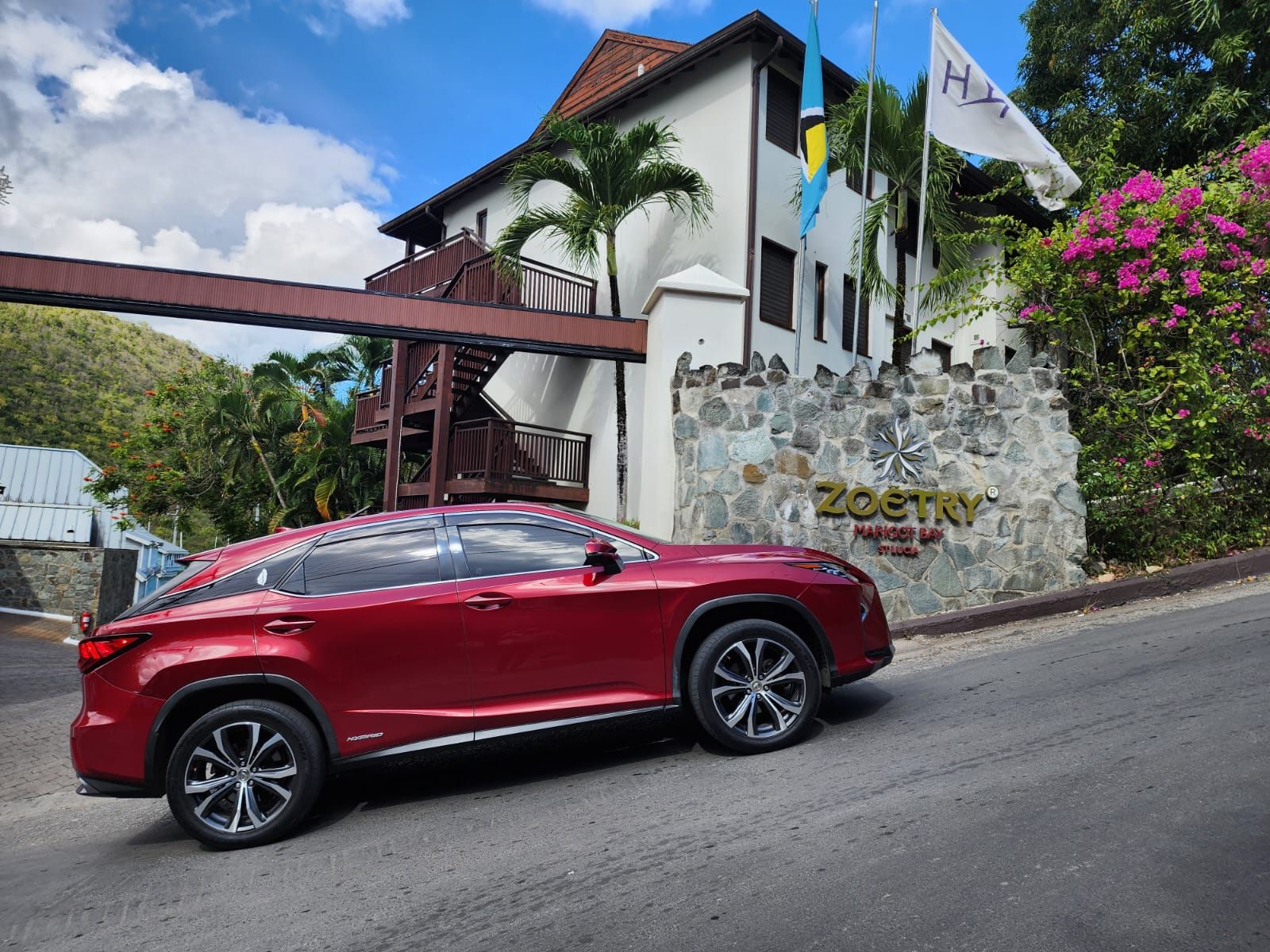 TS Services vehicle at a luxury resort entrance